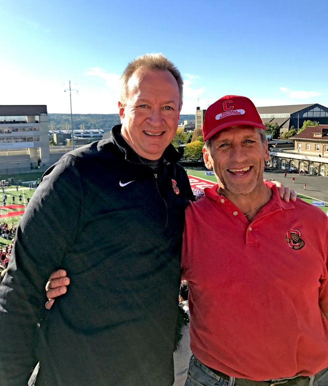 Jaan Janes '85 and Jim Spaller '86 watch the Big Red take on the Hoyas of Georgetown.