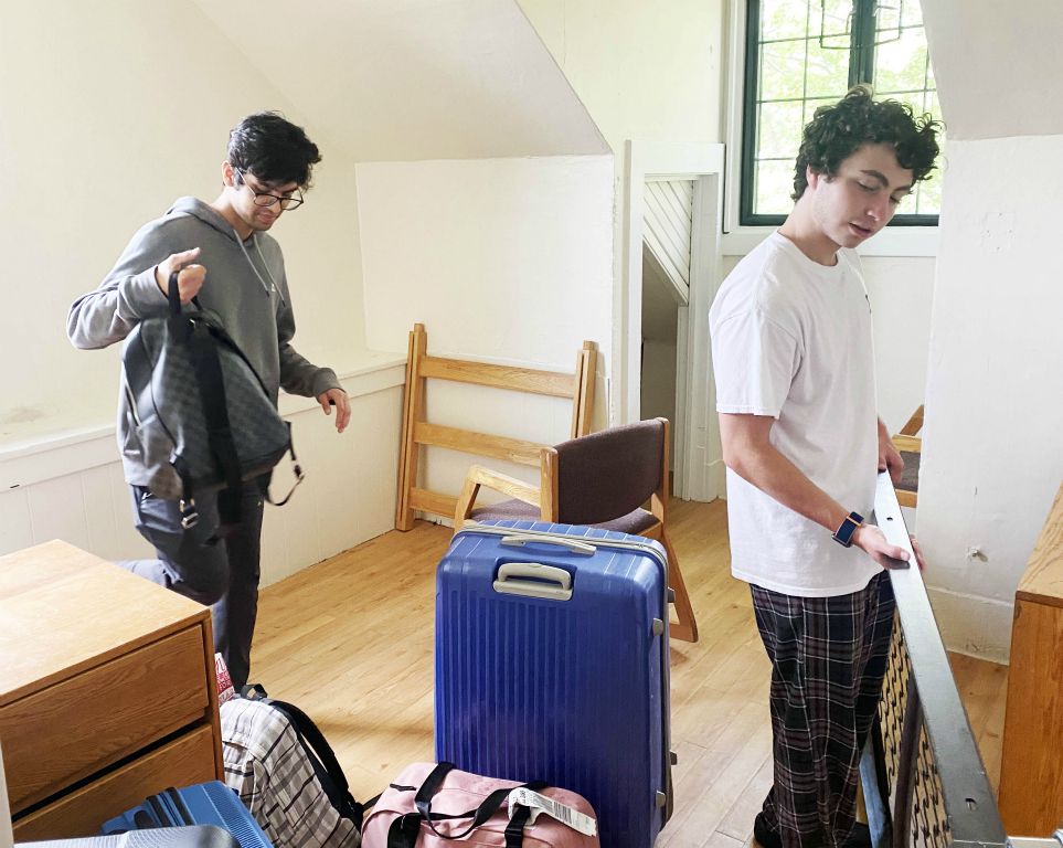 Keshav Goel '25 and Tyler Angelica '25 set up Keshav's room.